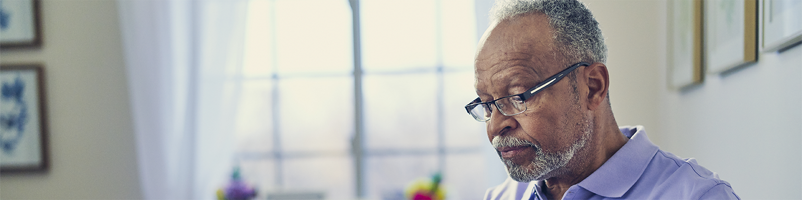 older man looking at a laptop